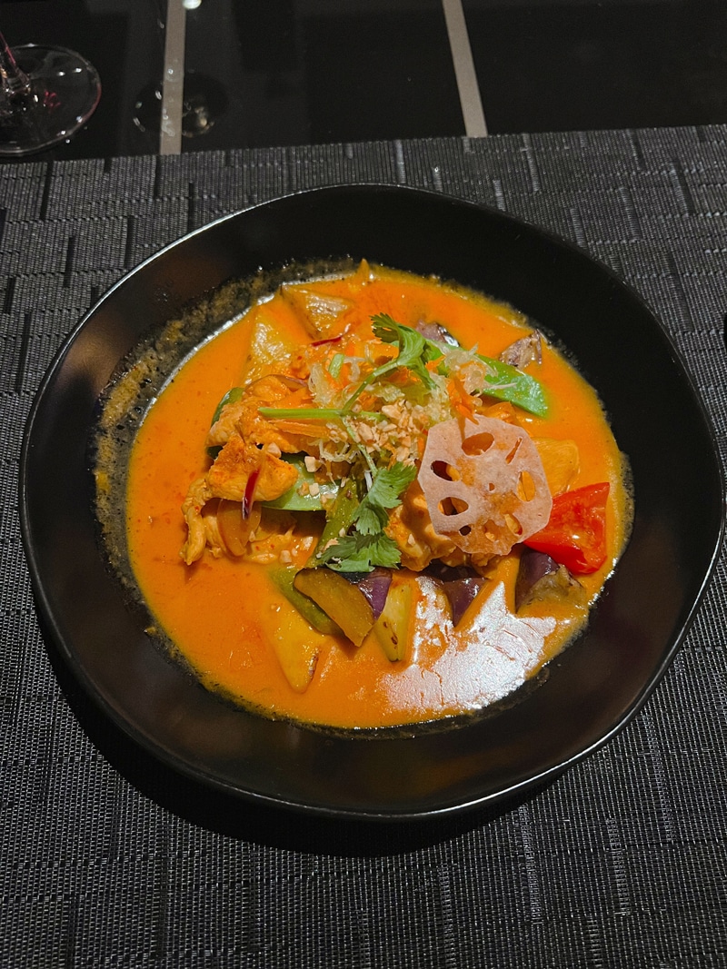 Tamarind Entree - Panang Red Curry Coconut Chicken: crispy lotus, wok-seared vegetables, roasted peanuts