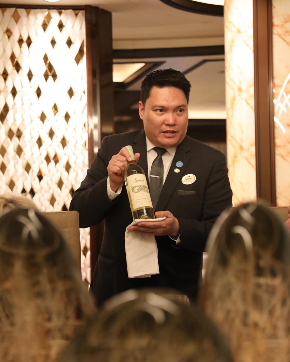 Timothy from Discovery Princess explaining wine for the Chef's Table