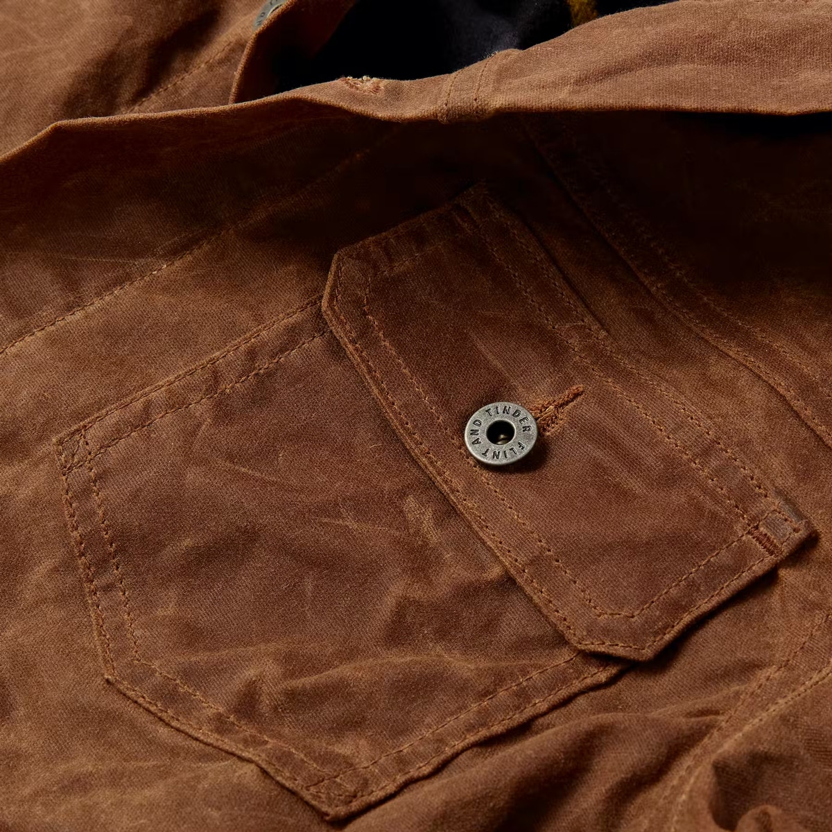 Close-up of Flint and Tinder's Flannel-Lined Wax Trucker Jacket