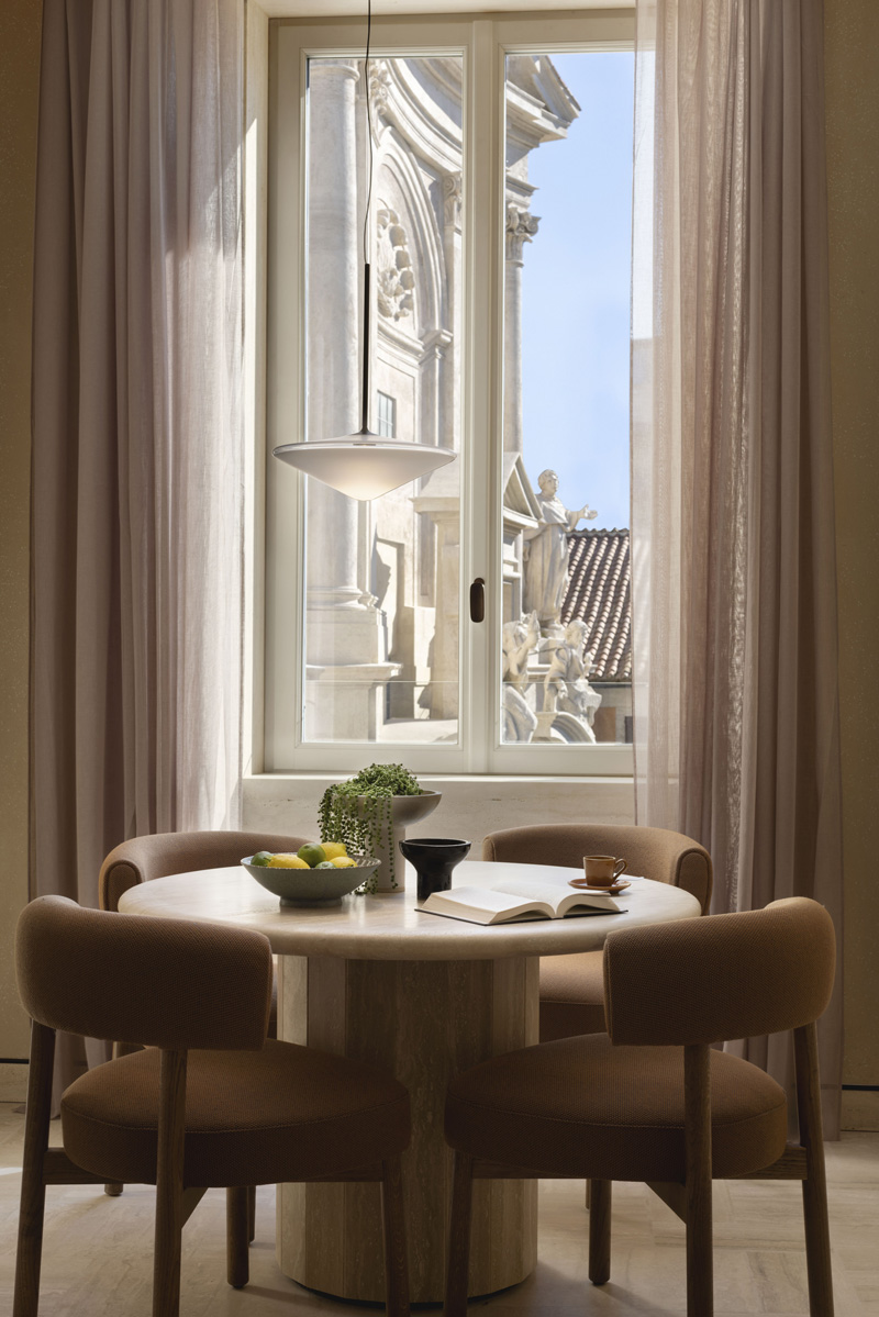 The Corner Suite at Six Senses Rome overlooks the restored façade of the San Marcello al Corso Church and offers a separate living room with extra space to relax and reconnect