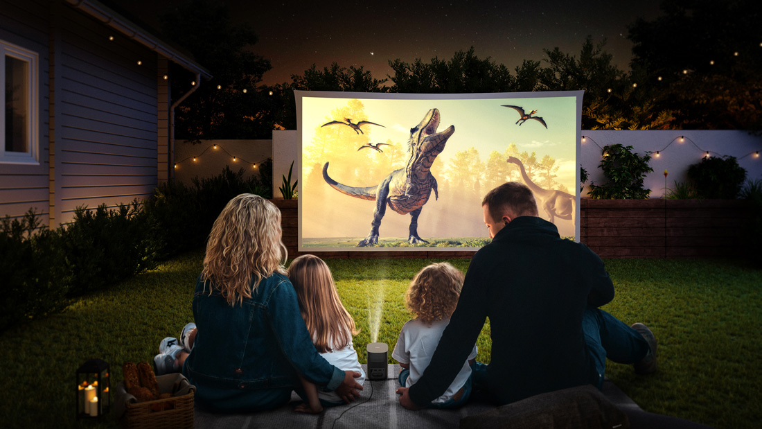 Family night outside with portable projector