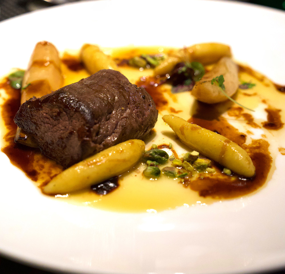 Slow Roasted Venison with Potato Noodles, Caramelized Pears, and Cherry Demiglace