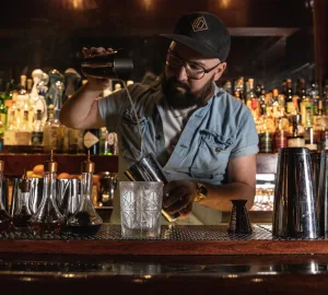 Sam Ross mixologist crafting cocktails for Holland America Line
