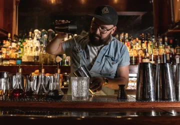 Sam Ross mixologist crafting cocktails for Holland America Line