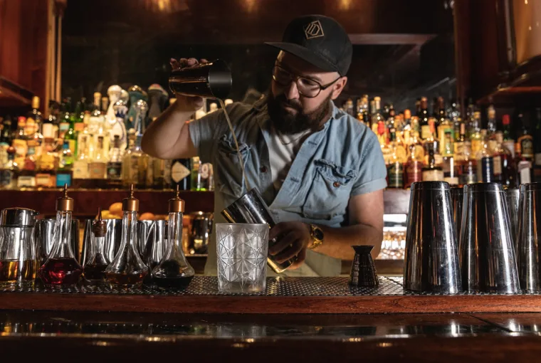 Sam Ross mixologist crafting cocktails for Holland America Line