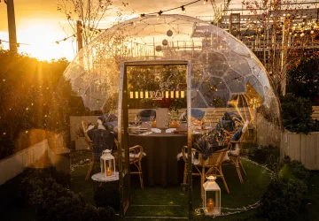 Heated Igloos and Festive Feasts Await at 1864 Rooftop Bar & Kitchen