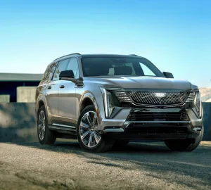 Front-angle view of the 2026 Cadillac Escalade IQL, an all-electric luxury SUV in a sleek black finish.