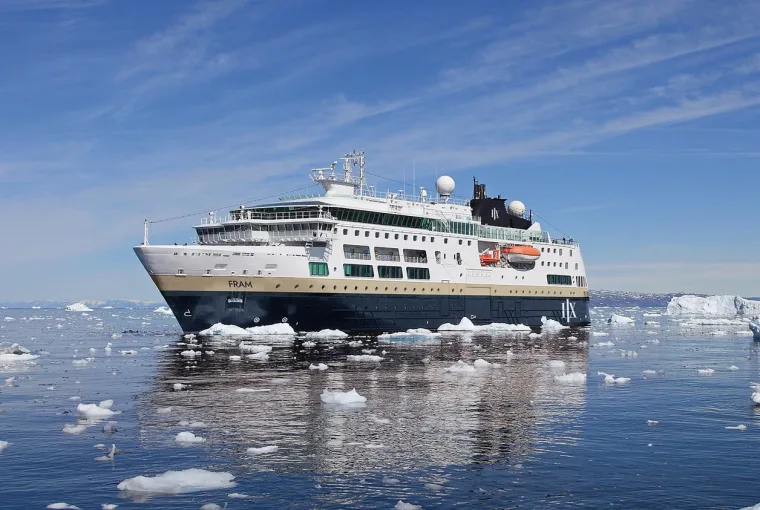 HX Expeditions ship in Indigo Blue and Sand sailing through icy waters