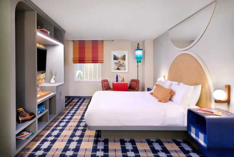 Interior of The Curtis Hotel’s Camp Curtis themed suite with glow-in-the-dark stars and wood accents.