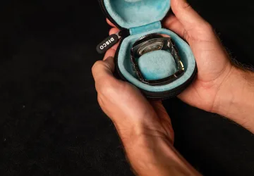 Discommon Goods The Puck leather watch travel case in black, open to reveal protective interior