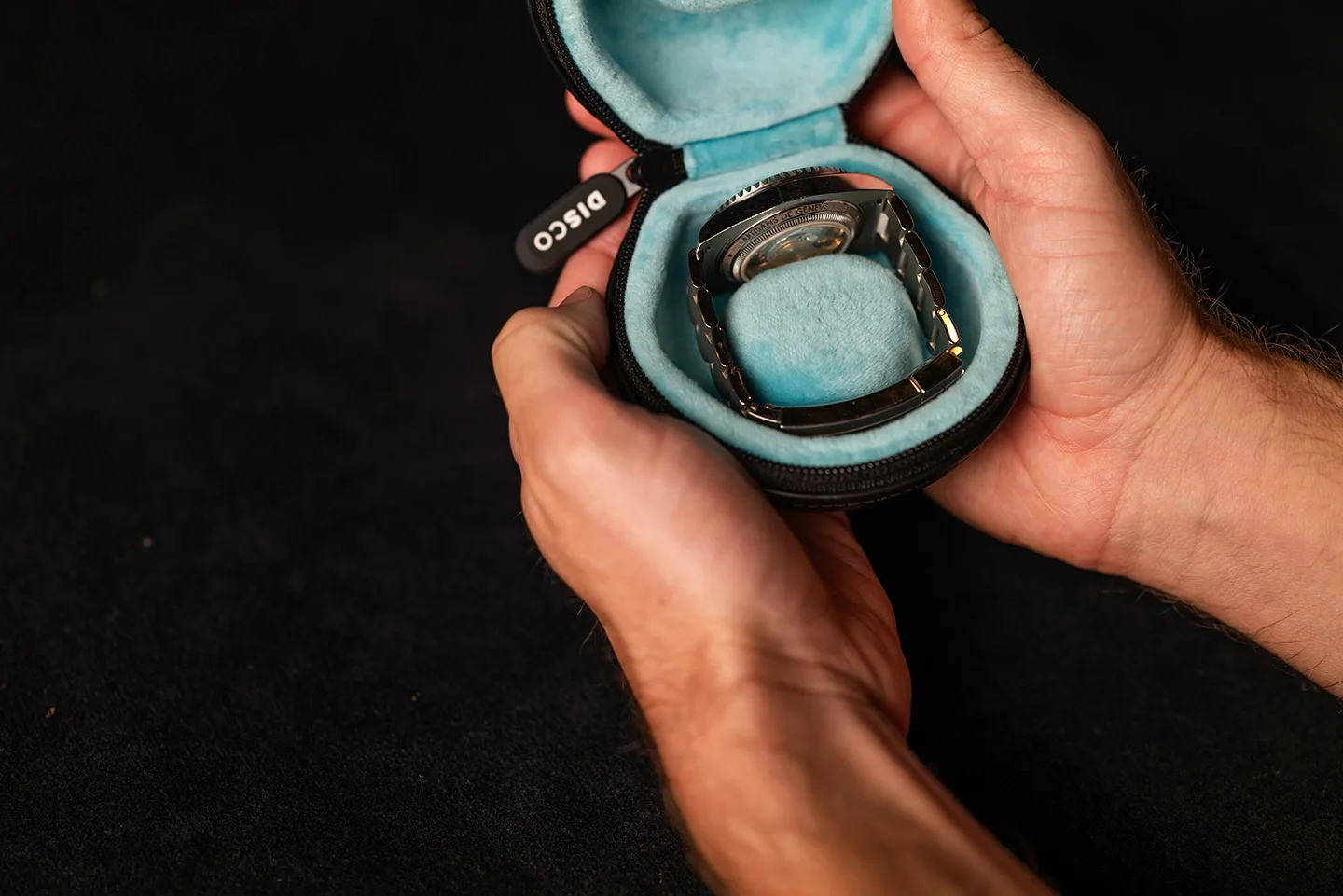 Discommon Goods The Puck leather watch travel case in black, open to reveal protective interior