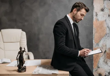 A man in serious consultation with a criminal defense attorney