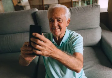 Senior man using a smartphone on a