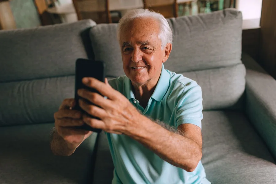 Senior man using a smartphone on a