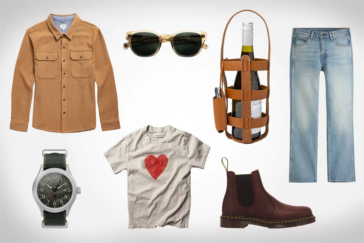Fall gifts for men laid out flat including boots, watch, and overshirt