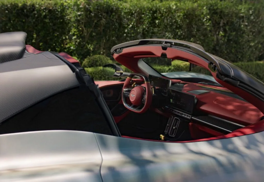Open cockpit of the Aston Martin Valhalla Spider with red leather interior.