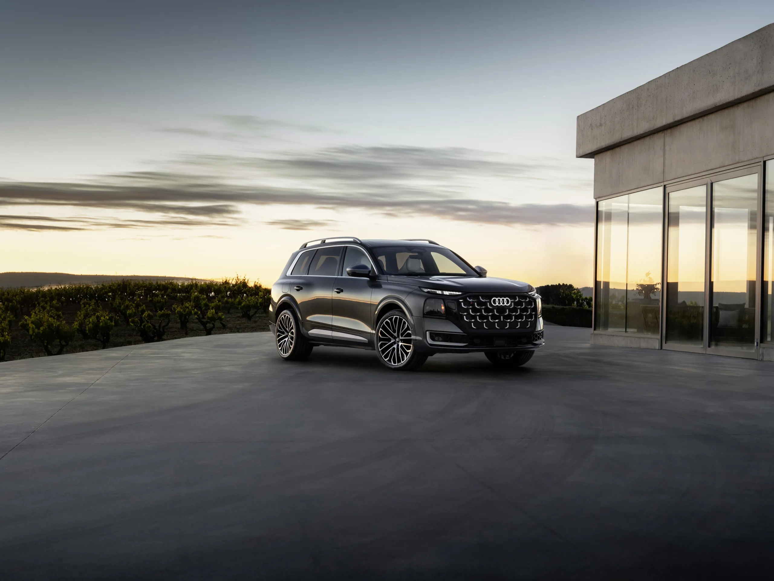 2027 Audi SQ9 three-quarter front view at dusk