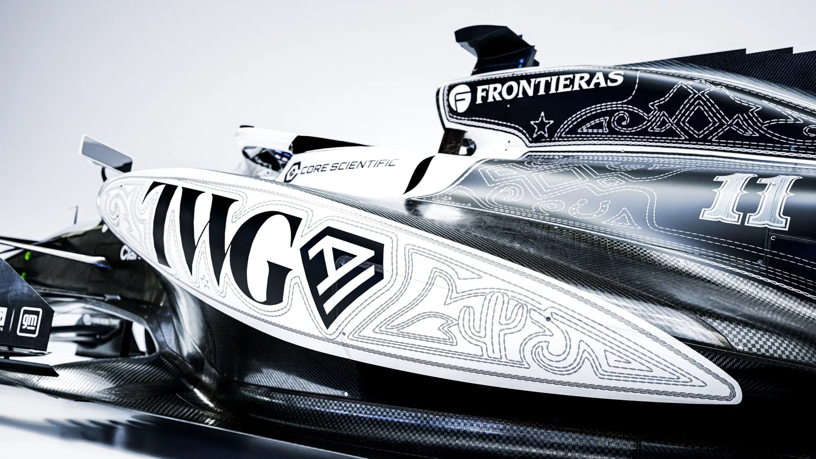 Close-up of the embroidered scrollwork and cactus detail on the Cadillac Formula 1 car's Texas-themed livery