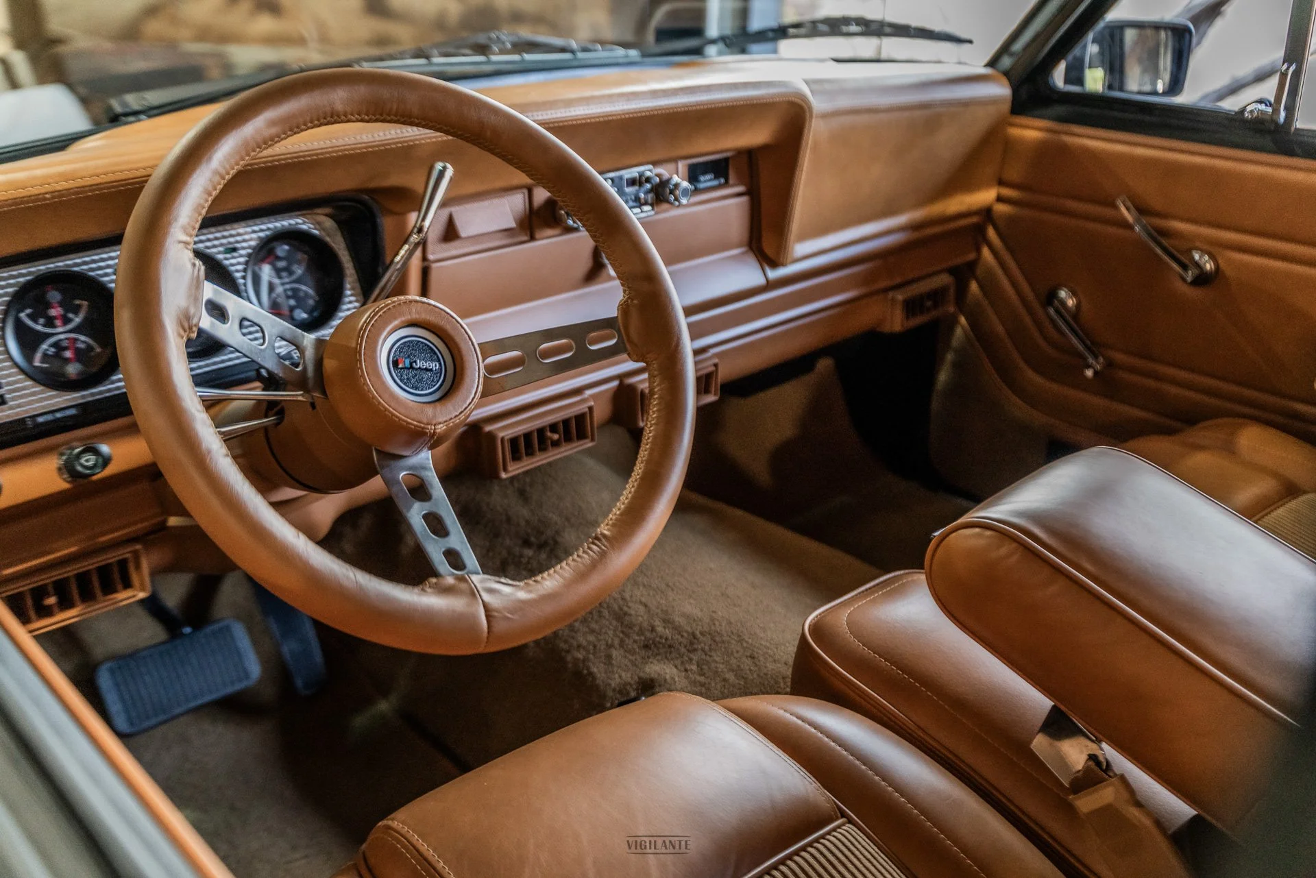 Vigilante 1979 Jeep Wagoneer The Blacked-Out whiskey leather interior